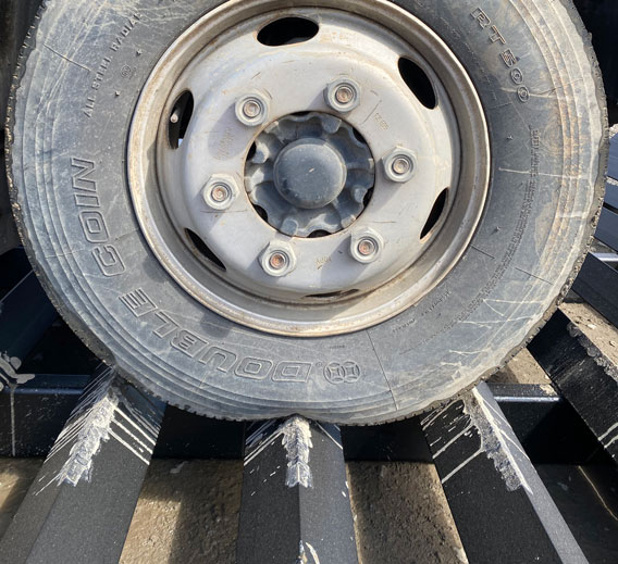 Close up of a truck tyre on a rumble grid
